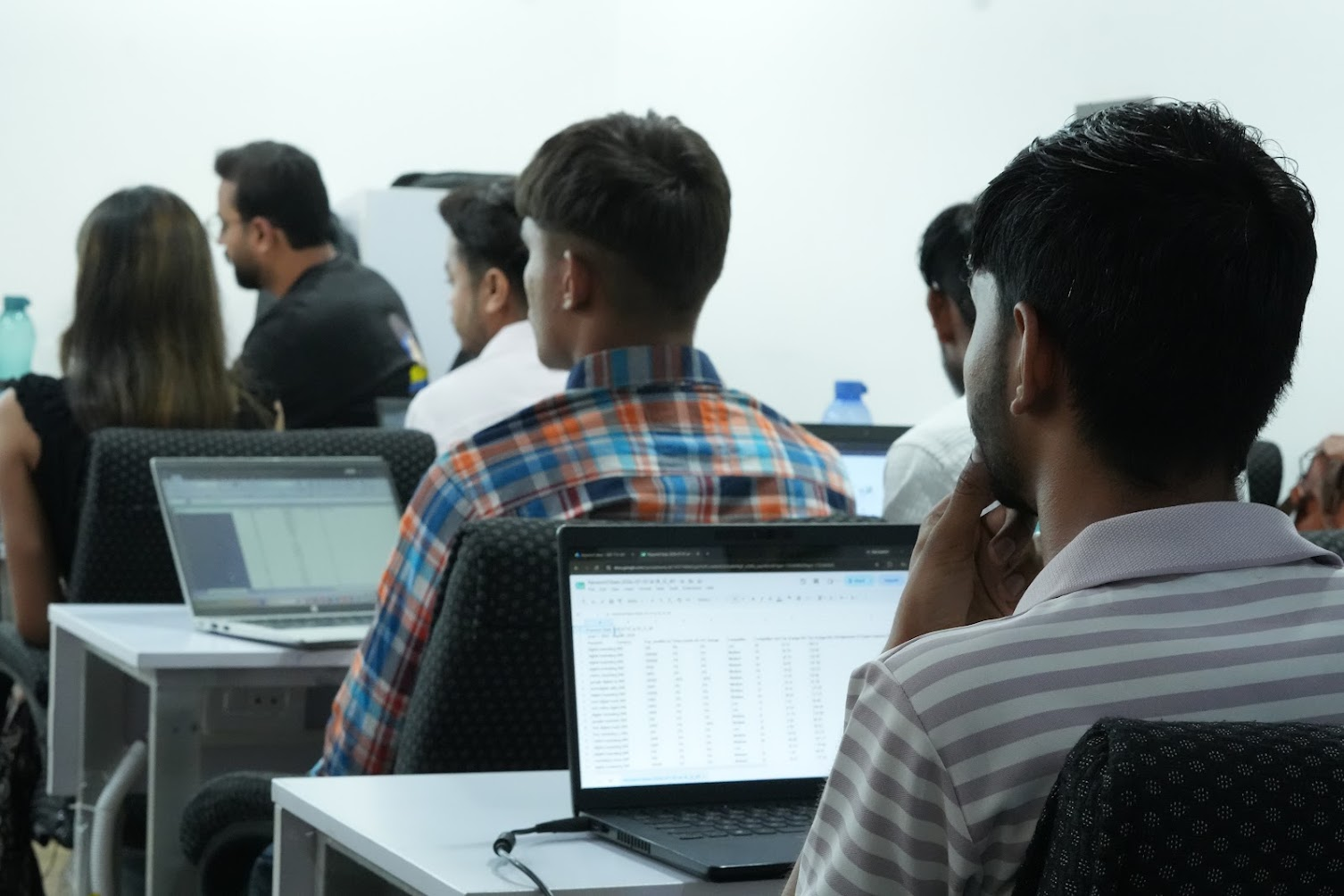 Students working on practical assignments during class